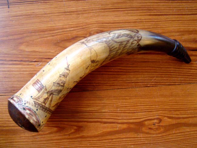 A rare and unbelievably beautiful American polycrome decorated and sailor carved patriotic powder horn circa 1810-1830